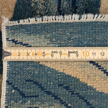 An antique Baotou rug, northern China, late Qing dynasty, circa 1900. c. 178x90 cm.