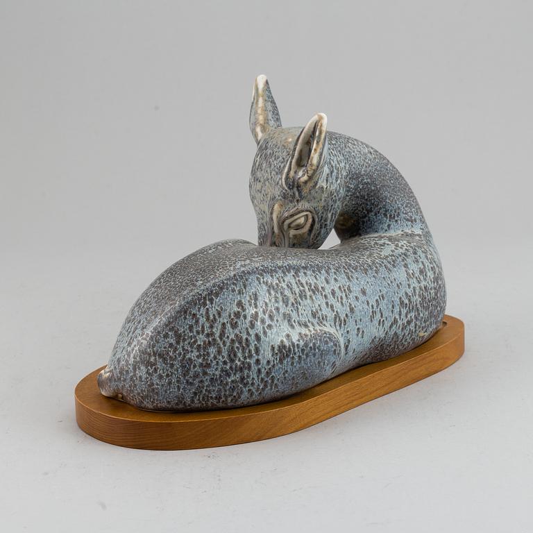 GUNNAR NYLUND, a unique stoneware sculpture of a reclining deer, Rörstrand, Sweden mid 20th Century.