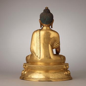 A finely cast Tibeto-Chinese gilt bronze figure of Shakyamuni Buddha, Qing dynasty, circa 1800.