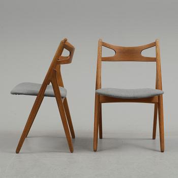 A set of four 'CH 29/Savbukkestolen' by Hans J Wegner, Carl Hansen & Søn, Denmark.