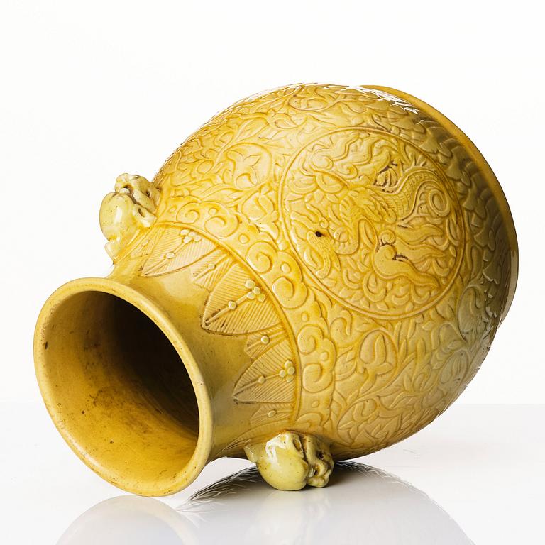 A yellow glazed phoenix vase,  Qing dynasty, with a Kangxi mark.