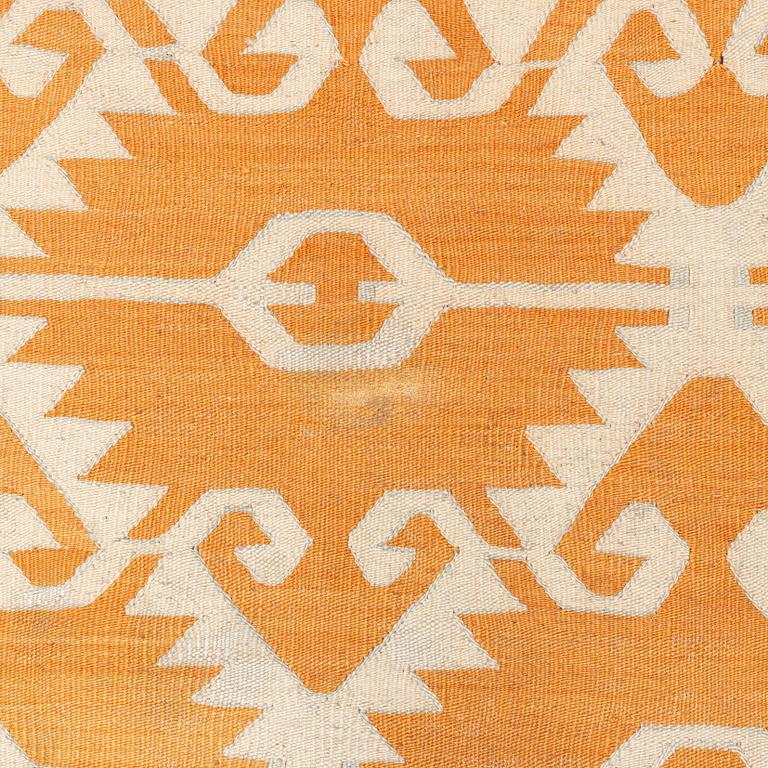 A flat weave rug, c. 285 x 263 cm.