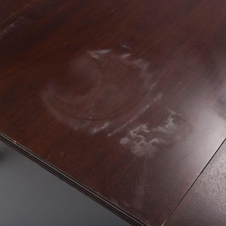 A second half of the 20th century mahogany  dining table with 5 additional leaves.