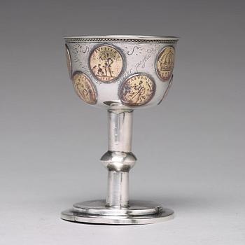 A Swedish 18th century parcel-gilt silver tumbler / cup, with copper coins, unmarked.