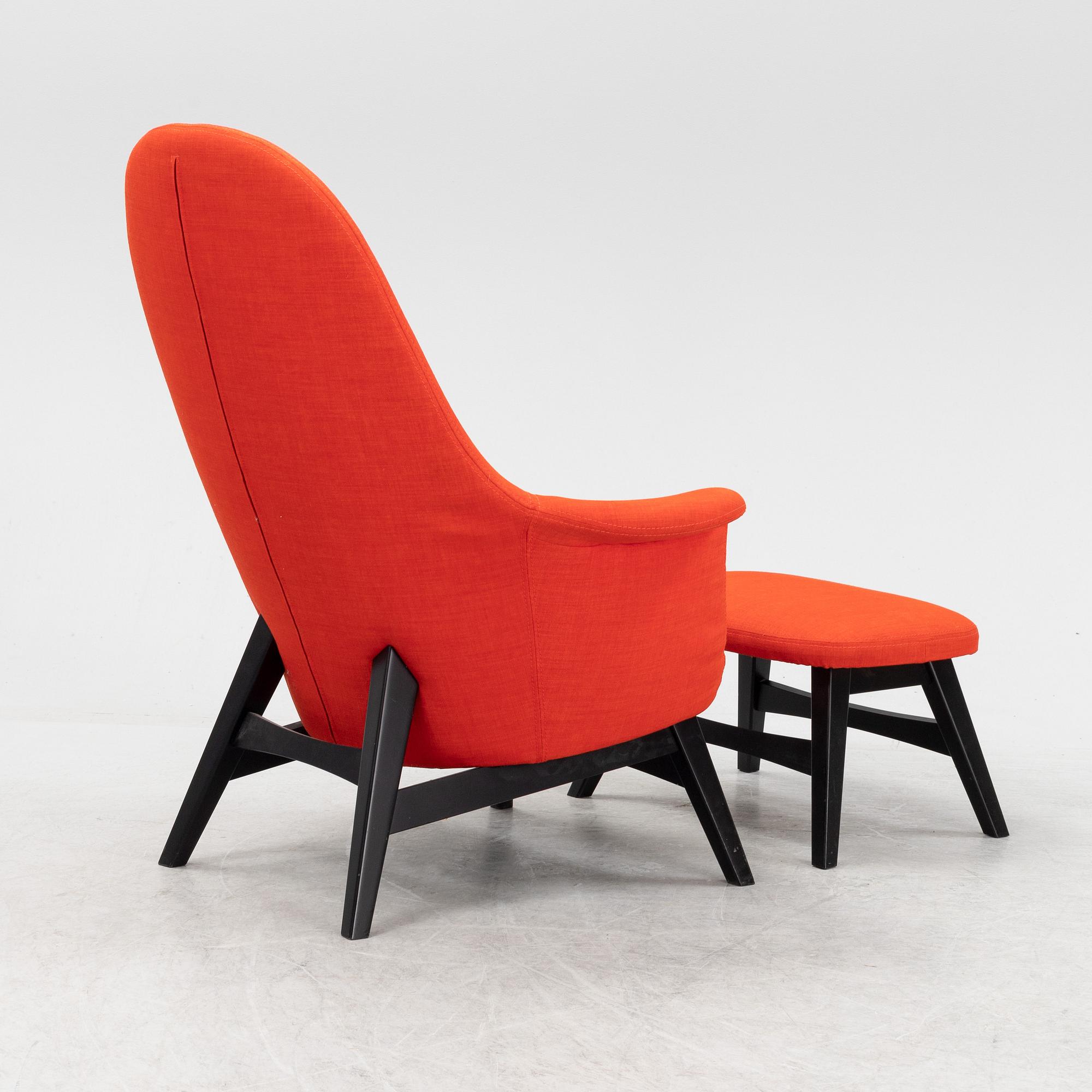 A 'Benarp/Genua easy chair with foot stool from Ikea,.