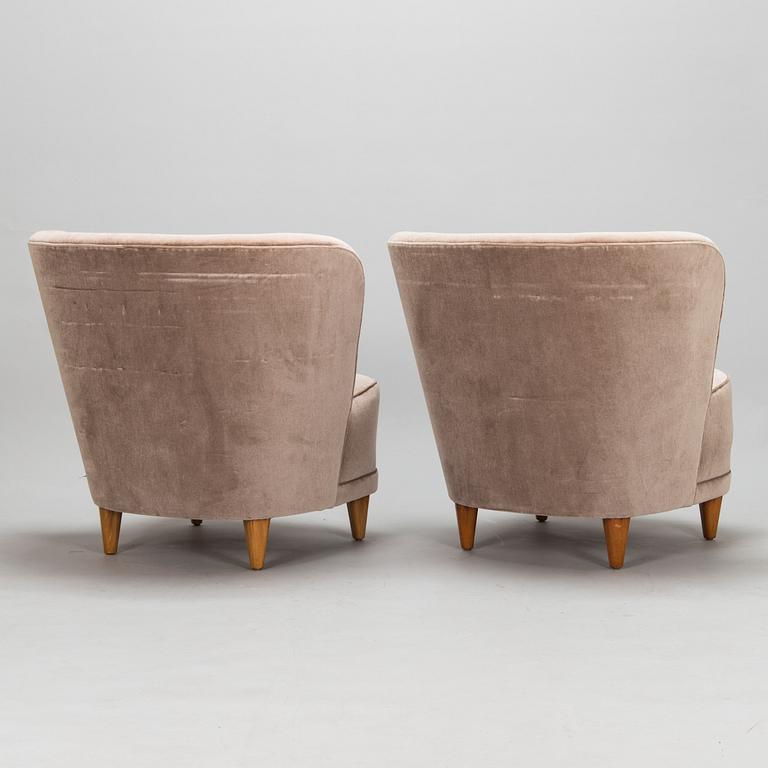 A mid-20th-century pair of armchairs.