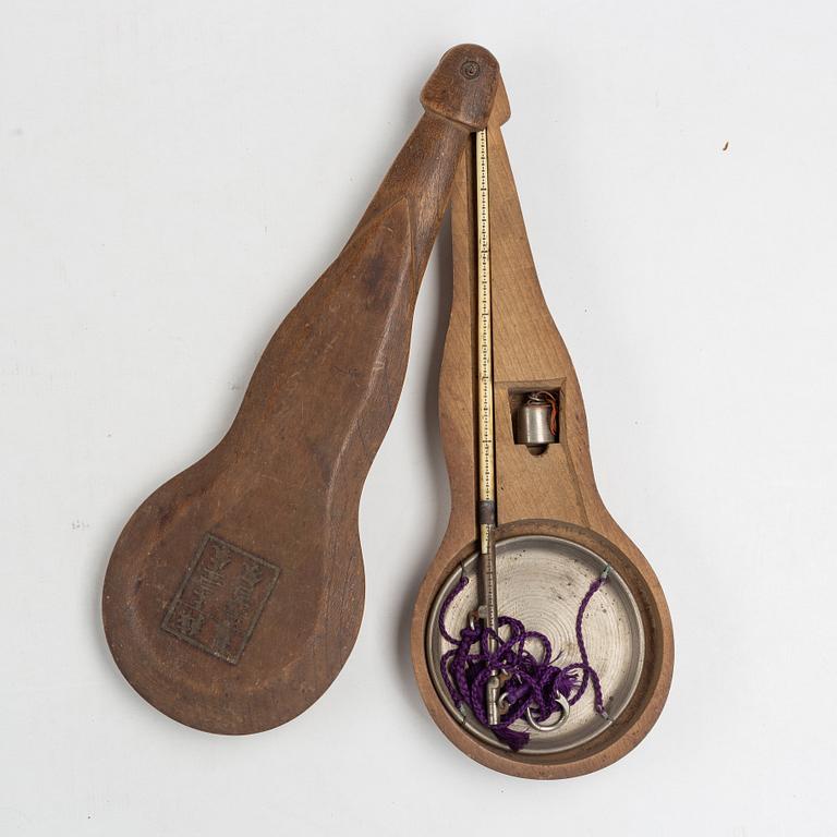 A Korean wooden wedding chest, two hats, an opium pipe, a scale, circa 1900.