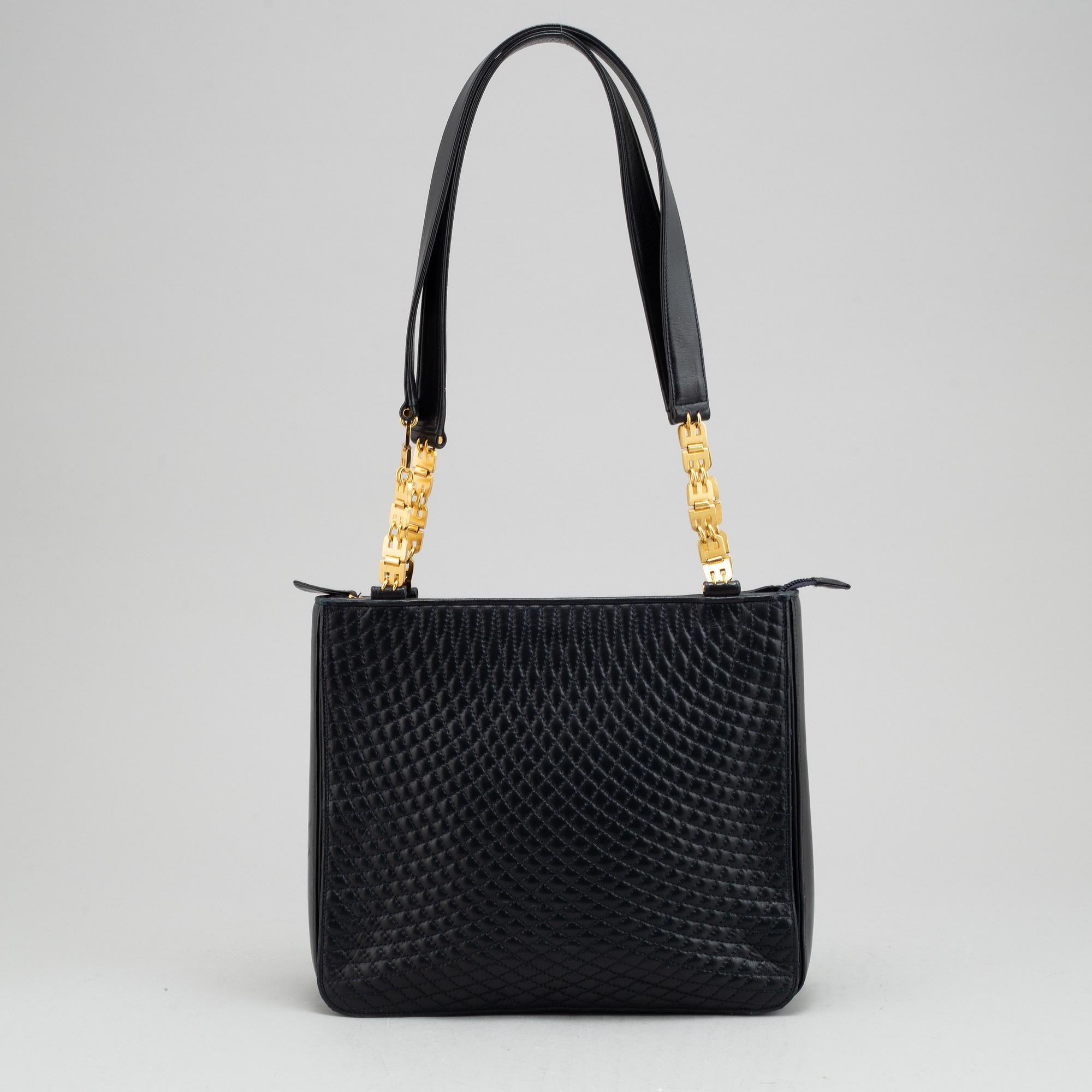Bally, a navy leather handbag.
