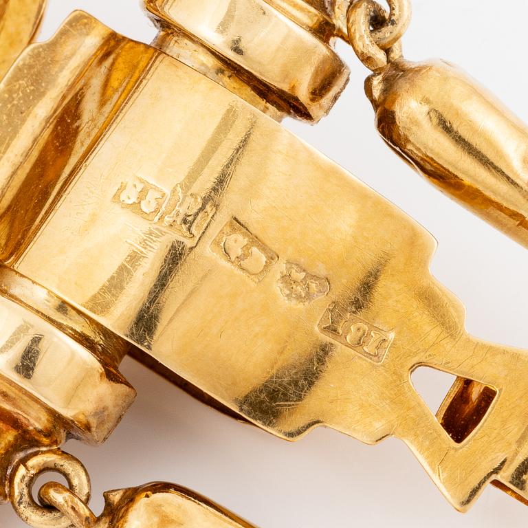 Brooch/pendant, 18K gold with half-pearls and black enamel. Malmö 1872.