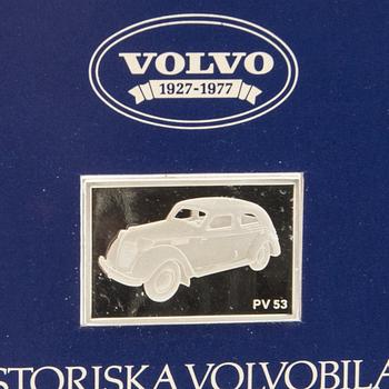 Twelve silver plaques with Volvo cars by Franklin Mint 1978.