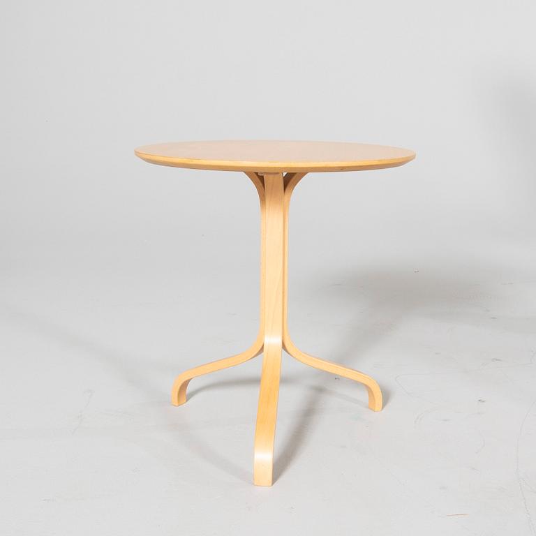 A 'Lamino' lounge chair, foot stool and side table by Yngve Ekström for Swedese.