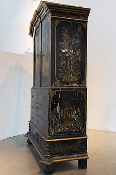 An early 18th century Chinese style cupboard.