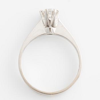 Ring solitaire with brilliant-cut diamond.