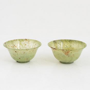 A pair of Chinese green stone bowls.