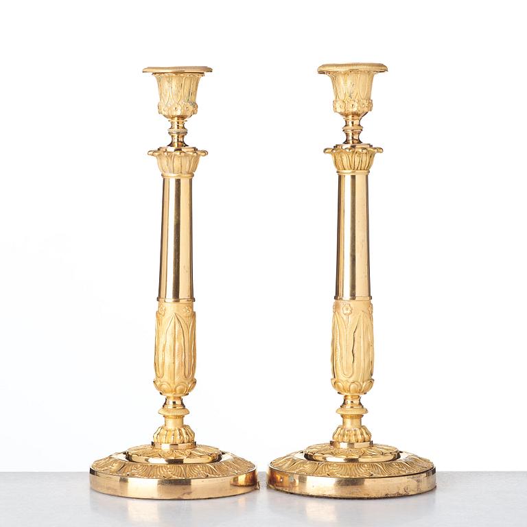 A pair of French Empire candlesticks, early 19th century.