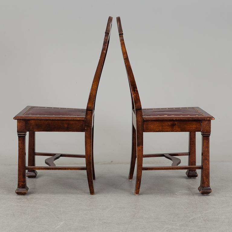 A late 19th century dining table with ten chairs and five extension leaves.