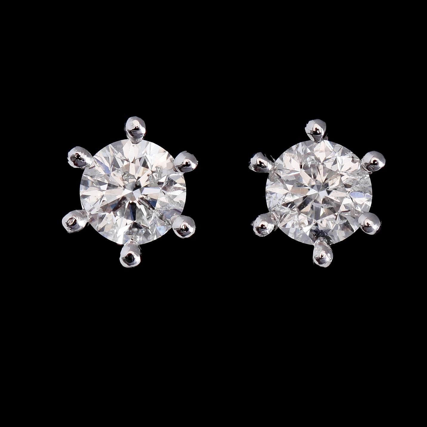 ÖRHÄNGEN, 1 par, 18K vitguld, solitära briljantslipade diamanter tot ca 1.10 ct.