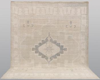 An oriental carpet, ca 312 x 256 cm.