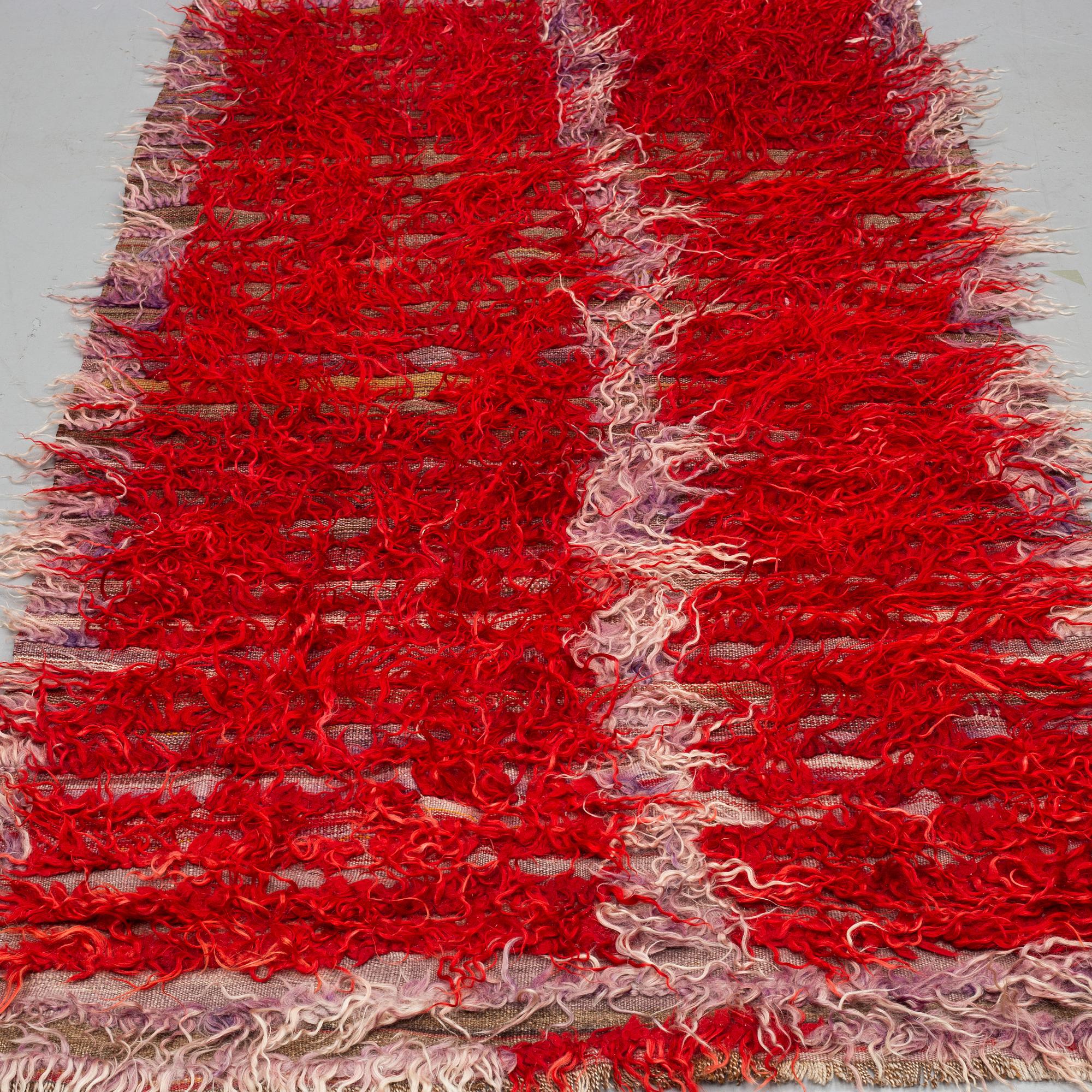 A RUG, a semi-antique Anatolian tülü, probably, ca 220 x 114 cm.
