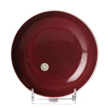 1168. A copper-red glazed dish, Qing dynasty, Qianlong mark and of the period (1736-95).