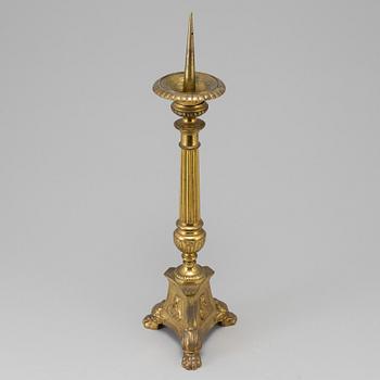 A 18th century bronze candlestick.