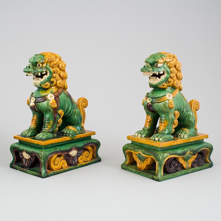 A pair of buddhist lion sculptures. 20th century.