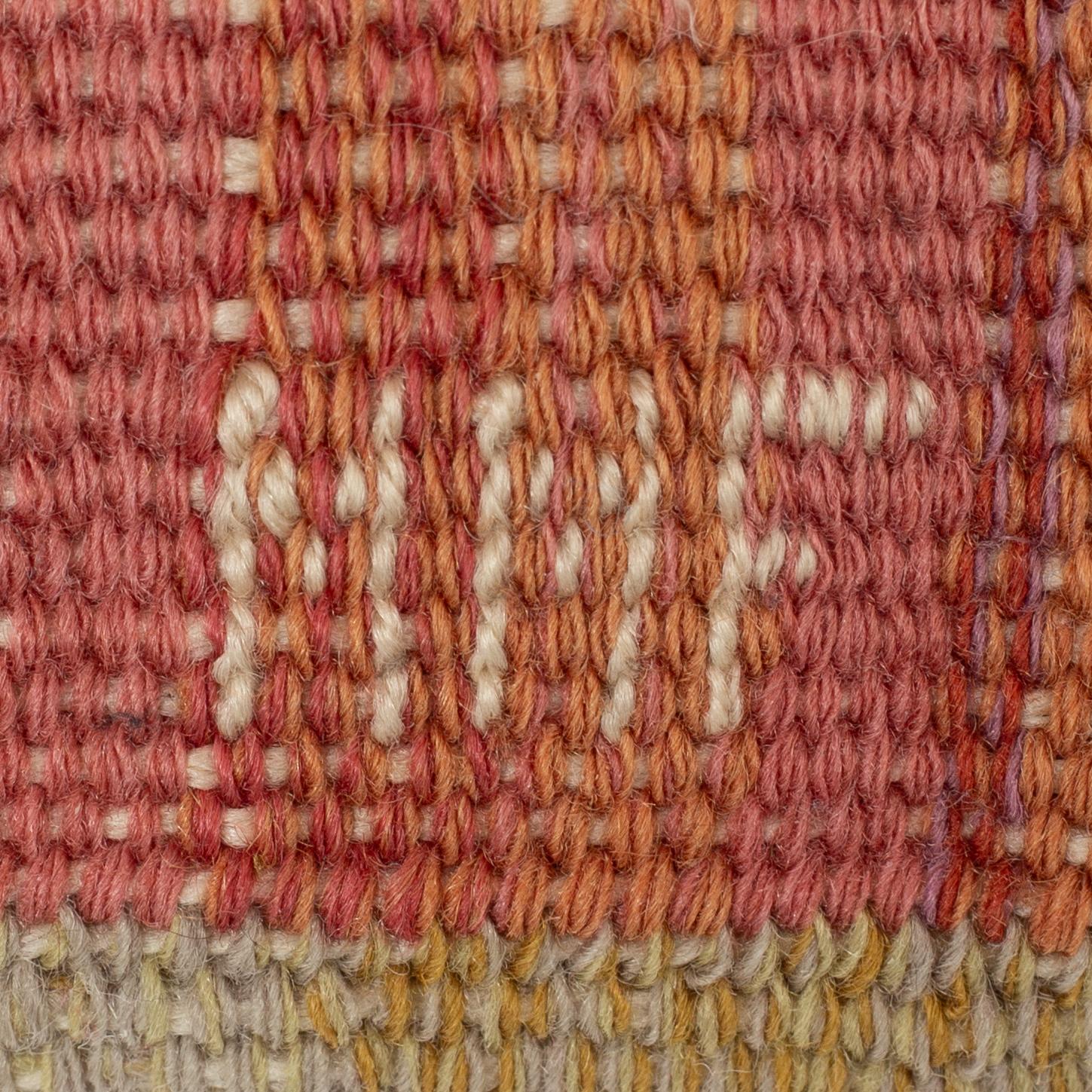 Märta Måås-Fjetterström, a cushion, 'Blommor på röd botten', signed MMF, c. 32 x 32 cm.