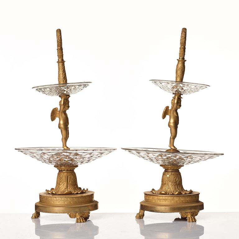 A pair of French Empire early 19th century gilt bronze and glass centre pieces in the manner of Pierre Philippe Thomire.