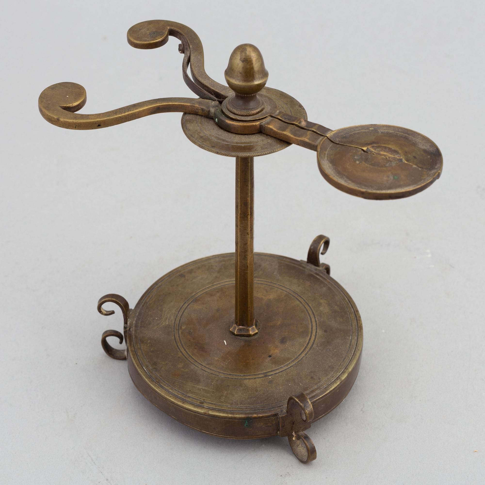 A 18th Century brass candle holder.