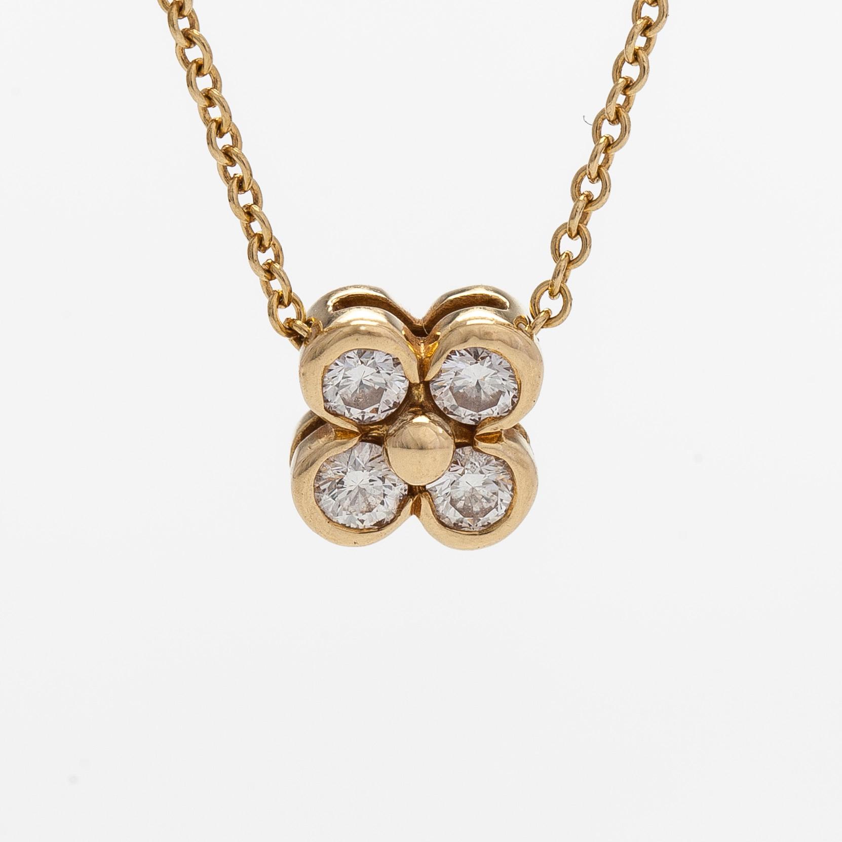 Tiffany & Co, an 18K gold necklace with diamonds.