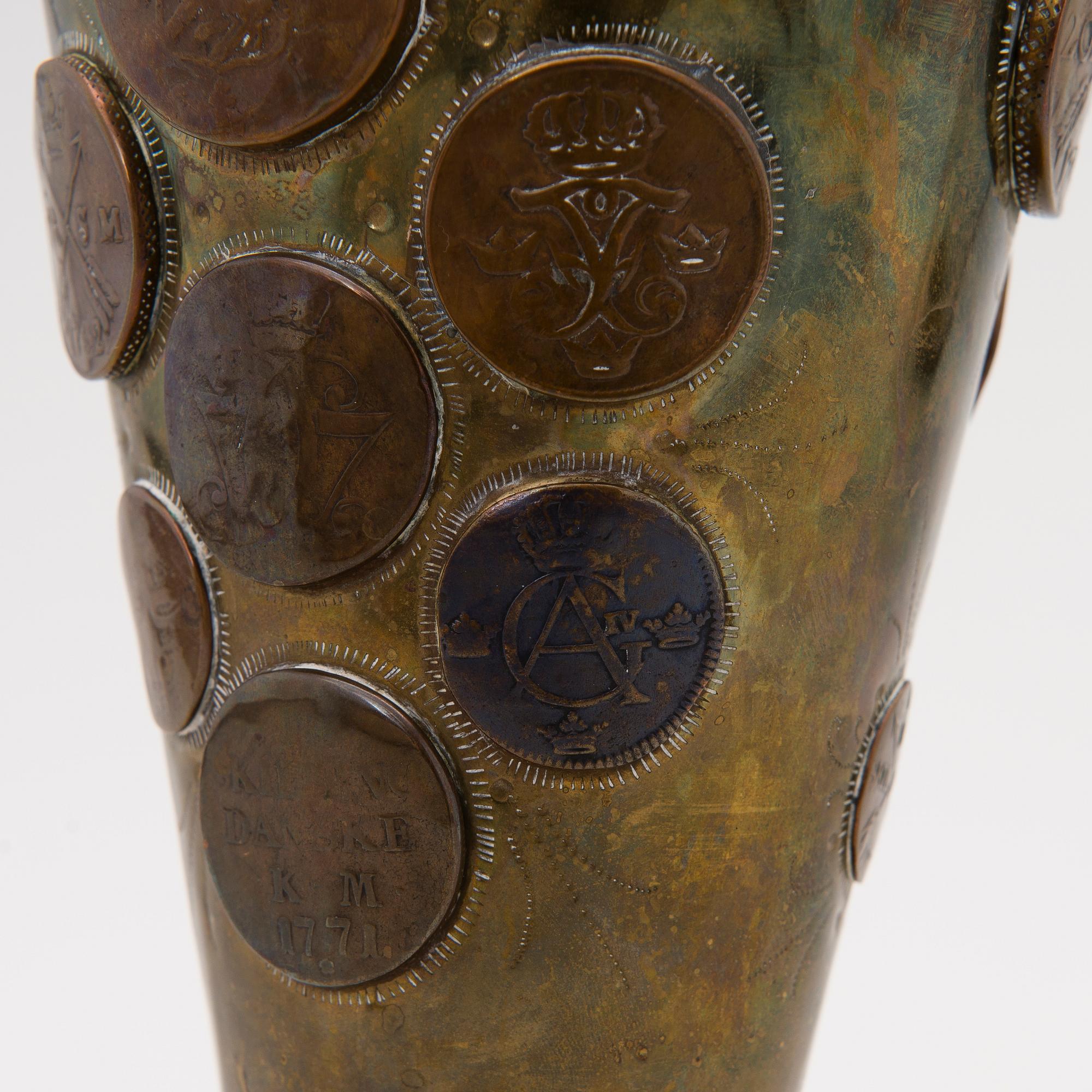 A late 19th Century brass cup.