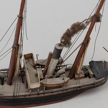 A 20th century wooden model of a steam engine boat.