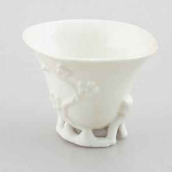 A blanc de chine rhinoceros libation cup, Qing dynasty, 18th century.