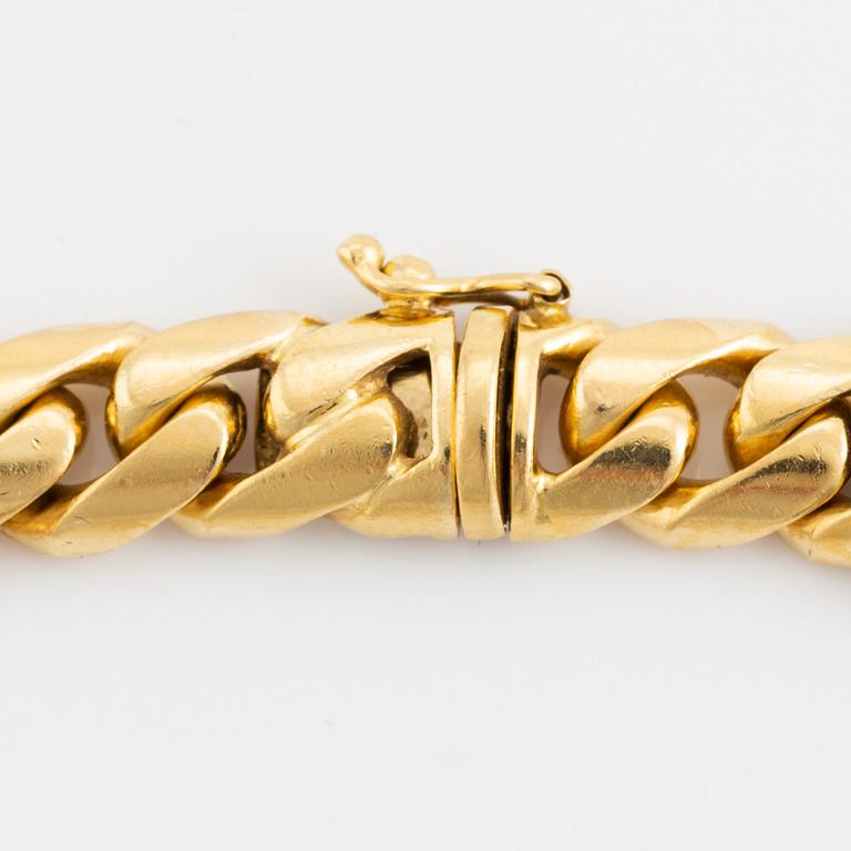 An 18K gold necklace/bracelet combination set with brilliant-cut diamonds.