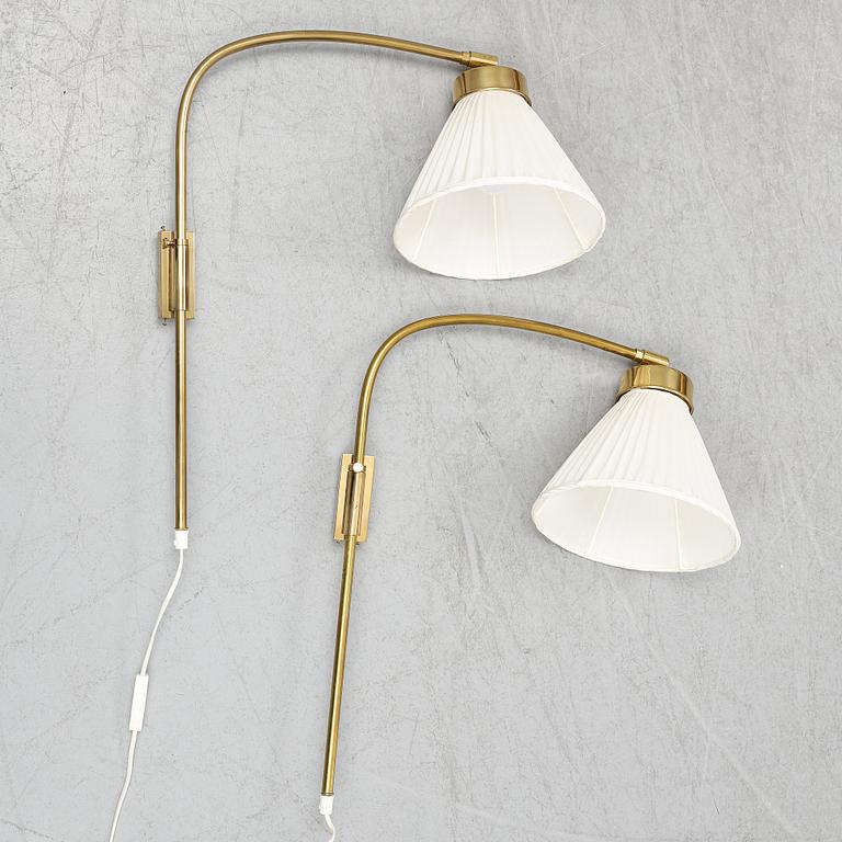 A pair of brass wall lamps, model 2484, designed by Josef FranK, Firma Svenskt Tenn.