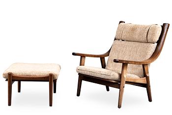 328. Hans J. Wegner, AN ARMCHAIR AND FOOTSTOOL GE 530.