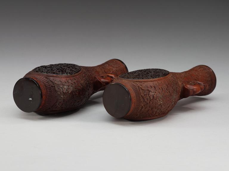 A pair of carved wooden and tortoise shell inlayed vases, presumably late Qing dynasty (1644-1912).