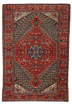 282. A RUG, a semi-antique Bachtiari "mille-fleur", ca 200,5 x 135,5 cm.