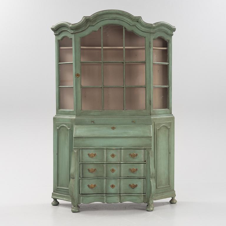 A Rococo cabinet with vitrine top.