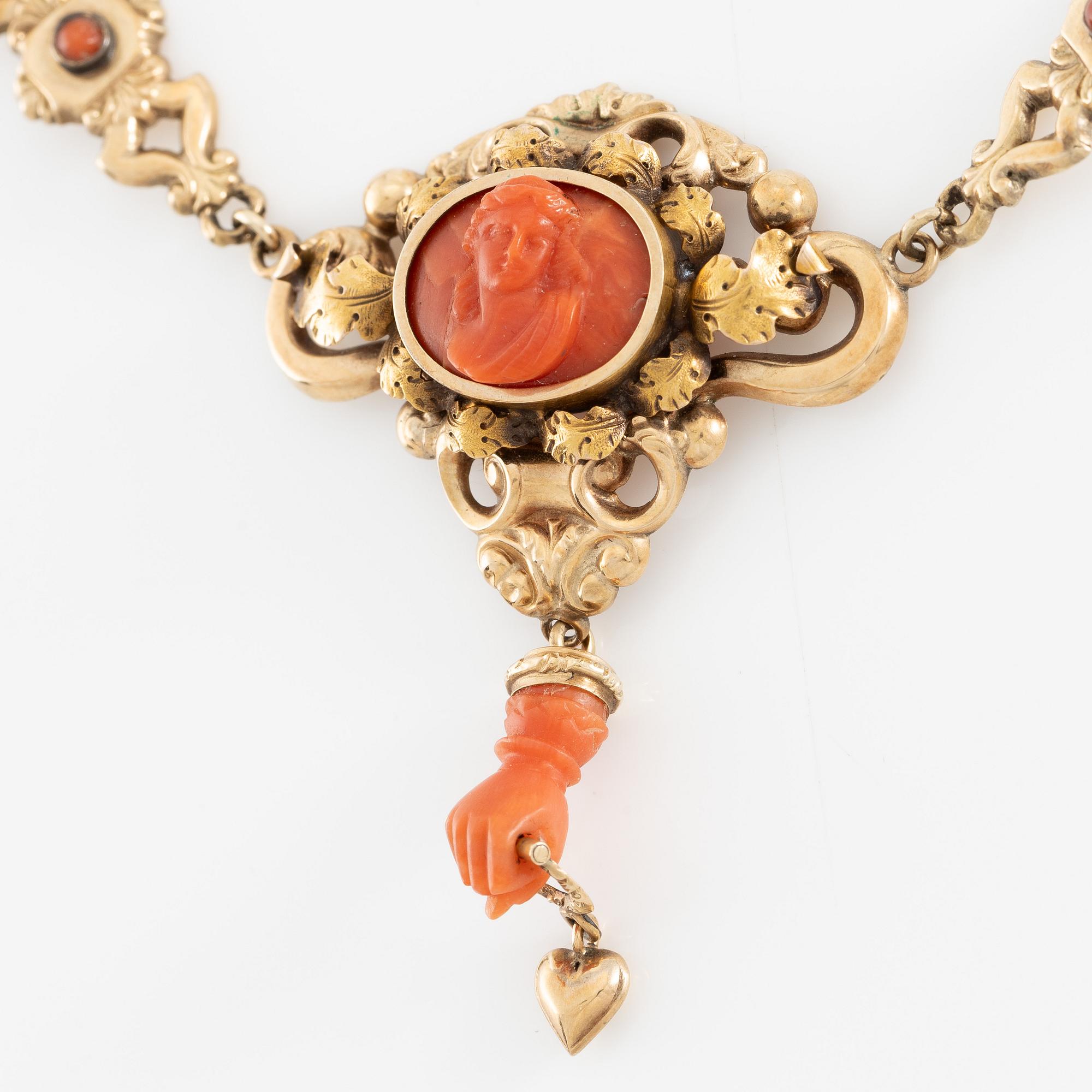 Necklace in 14K gold with carved coral. Probably around the turn of the century 1900.