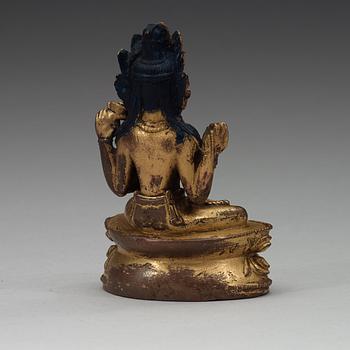 A Tibetan gilt copper alloy figure of Boddhisattva Shadakshari Lokeshvara, 16th Century or older.