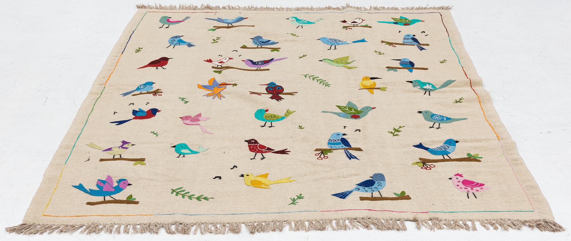 A hand-embroidered Kelim rug, c. 230 x 173 cm.