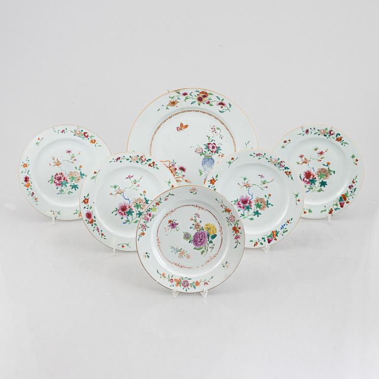 Five Famille rose plates and a charger, China, Qianlong (1736-95).