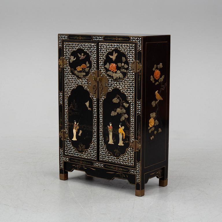 A Chinese black lacquered cabinet, 20th century.