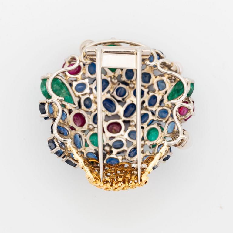 An 18K gold Carlman brooch set with sapphires, emeralds, rubies and pearls.