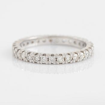 Brilliant cut diamond eternity ring.