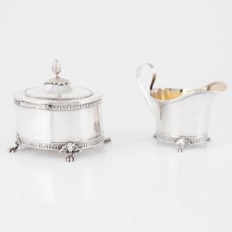 A Swedish silver sugar box and creamer, marks of Jacob Engelberth Torsk, Stockholm 1902.