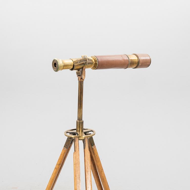 A brass and leahter tube binocular with stand around 1900.