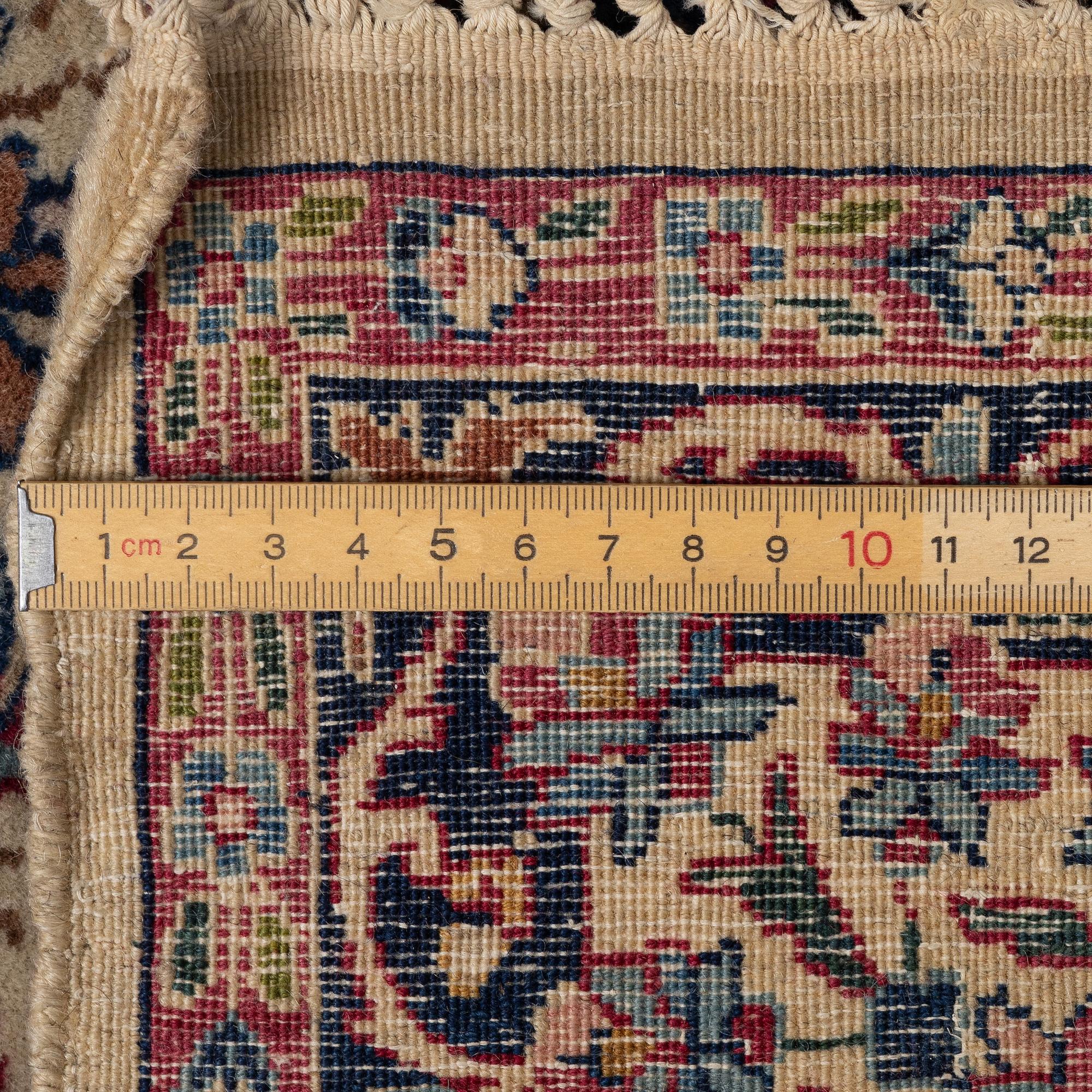 A semi antique Kirman rug, South Persia, c. 228 x 136 cm.
