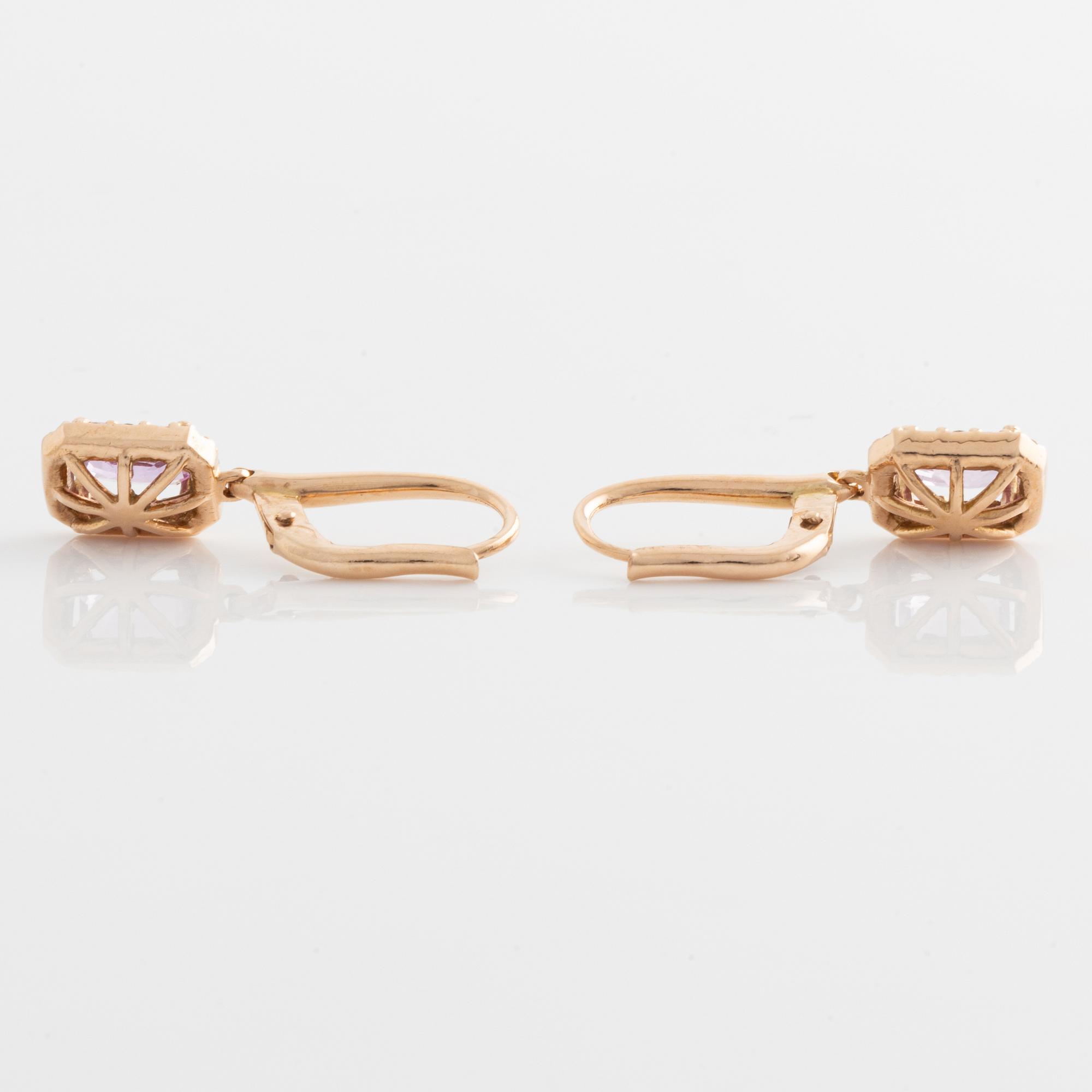 Earrings with pink sapphires and diamonds.